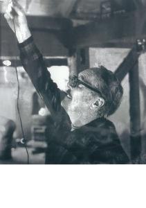 Papa Jack hanging Christmas lights in our first house in Maine